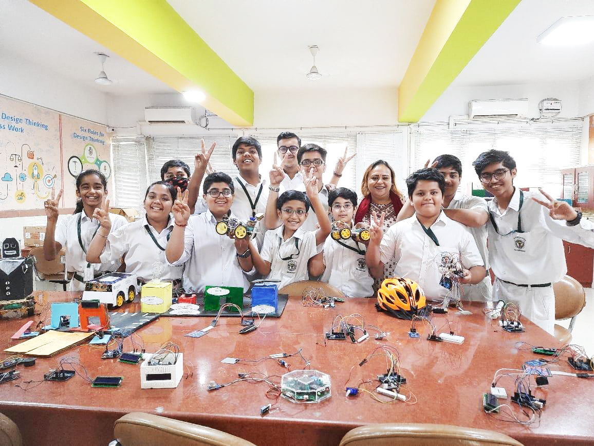 Students learning robotics together in a lab